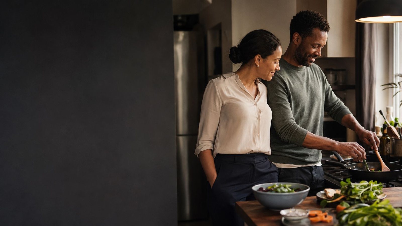 A couple cooking together in their kitchen